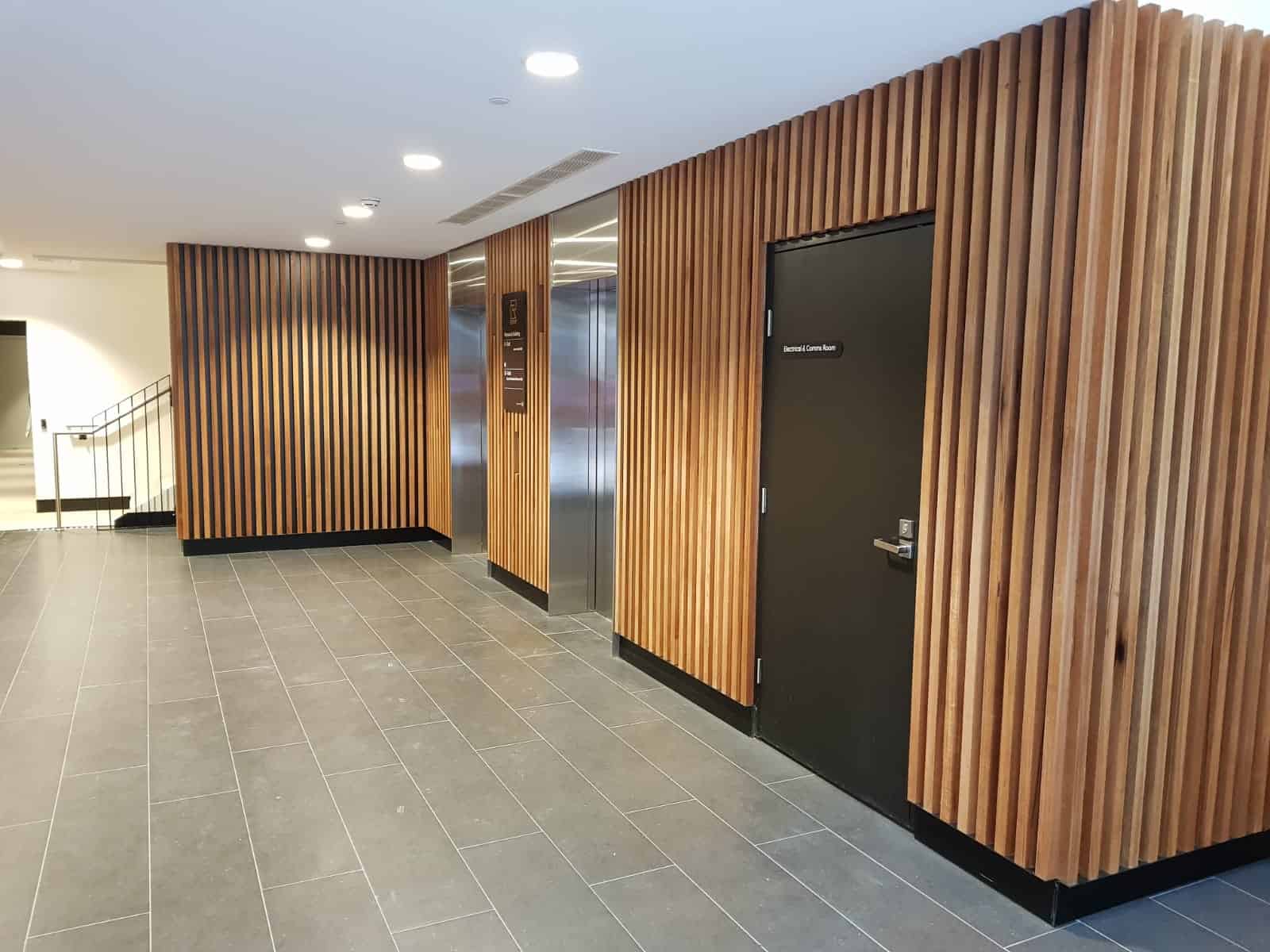 Custom wooden boards mounted to a wall in Raine Square, Perth